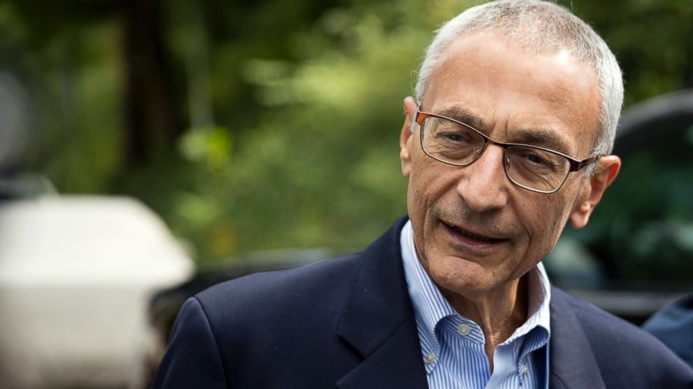John Podesta speaks to members of the media outside Clinton's home in Washington.