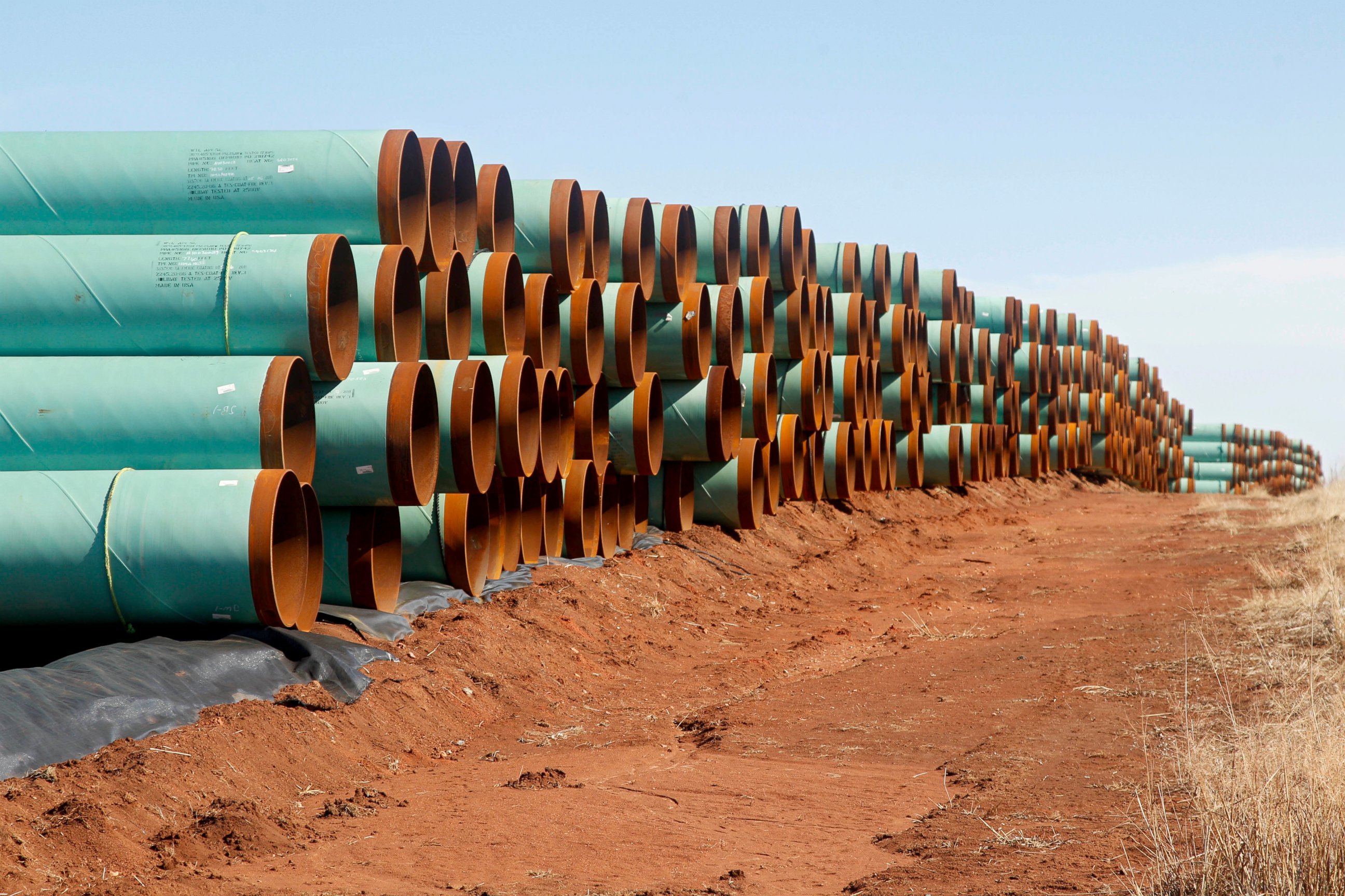 PHOTO: Miles of pipe ready to become part of the Keystone Pipeline are stacked in a field near Cushing, Okla. 