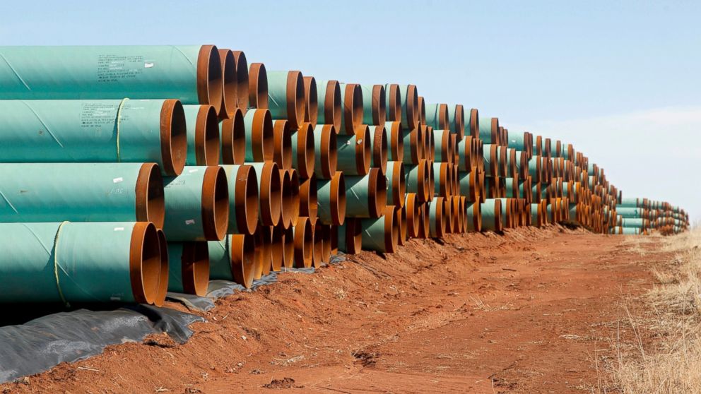 Miles of pipe ready to become part of the Keystone Pipeline are stacked in a field near Cushing, Okla. 