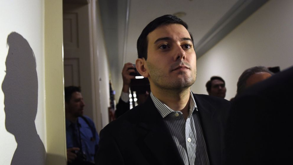 Pharmaceutical chief Martin Shkreli is followed by reporters on Capitol Hill in Washington, Feb. 4, 2016, following his appearance before the House Committee on Oversight and Reform Committee. 
