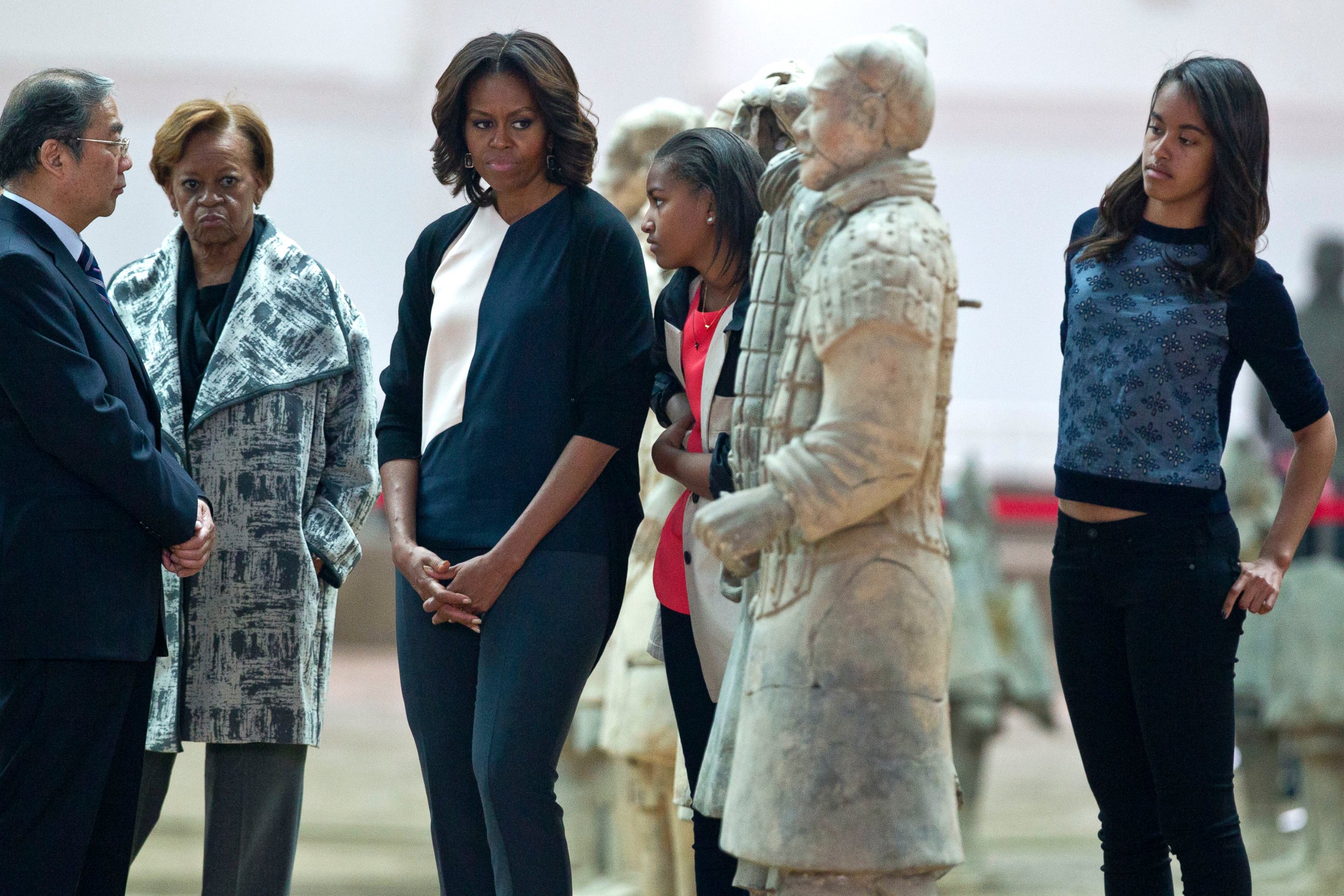 PHOTO: U.S. first lady Michelle Obama, center, visits Qinshihuang Terracotta Warriors and Horses Museum with her daughters mother in Xi'an, in northwestern China's Shaanxi province, March 24, 2014.