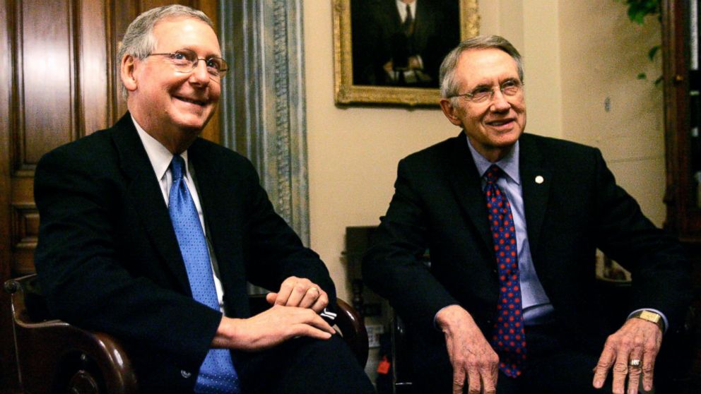Incoming Senate majority leader Harry Reid, D-Nev., right, and incoming Senate minority leader Mitch McConnell, R-Ky., talk during a photo opportunity on Capitol Hill, Nov. 15, 2006, in Washington.