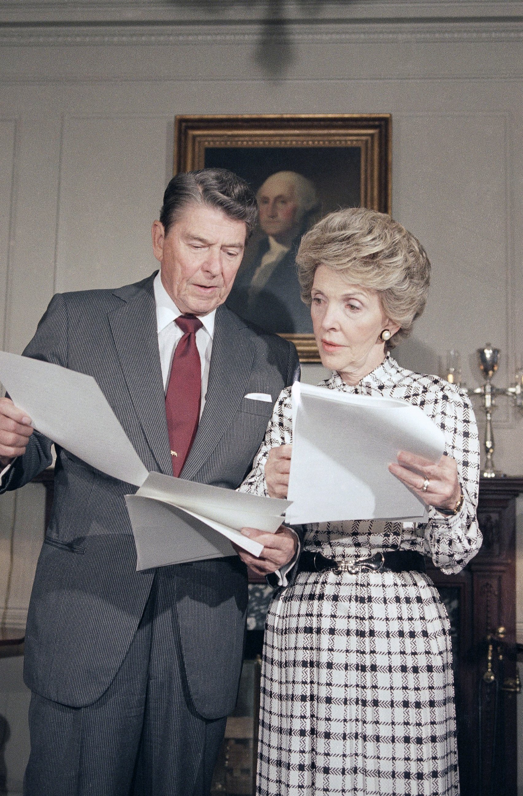 PHOTO:Ronald Reagan and Mrs. Nancy Reagan go over their joint address which they will give to the nation, at the White House in Washington, Sept. 13, 1986. The address will focus on the war against drug abuse.  