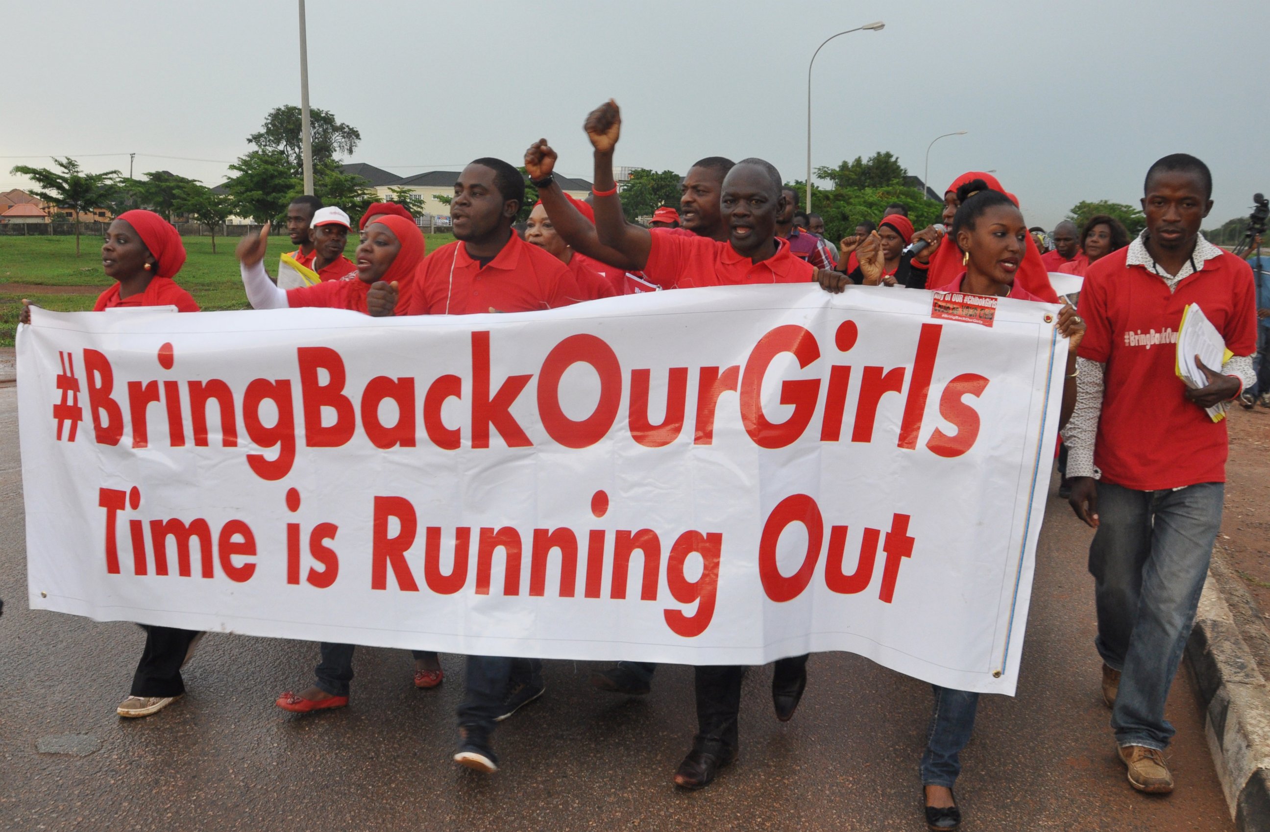 PHOTO: People shout slogans and hold a banner during a demonstration calling on the government to rescue the kidnapped girls of the government secondary school in Chibok, Nigeria on Sept. 11, 2014 in Abuja, Nigeria. 