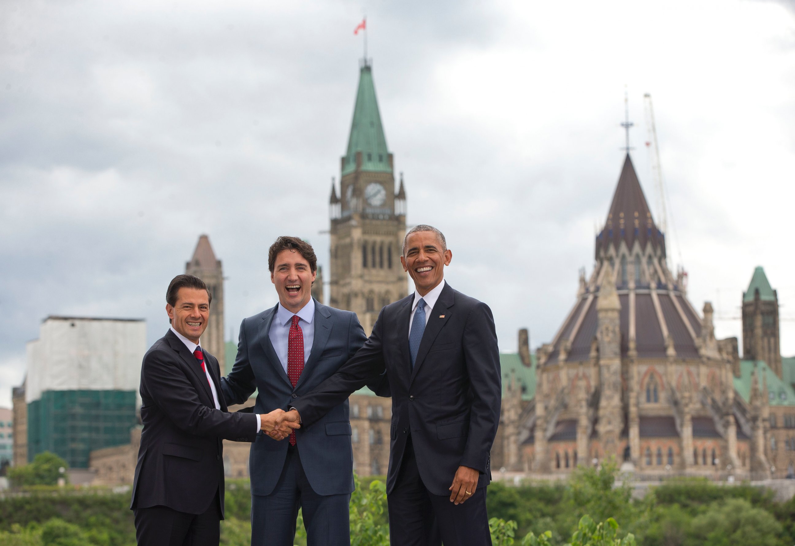 PHOTO: (L-R) Mexican President Enrique Pena Neito Mexican President Enrique Pena Neito and President Barack Obama stand in front of Parliament Hill for a group photo during the North America Leaders' Summit,  June 29, 2016, in Ottawa, Canada.