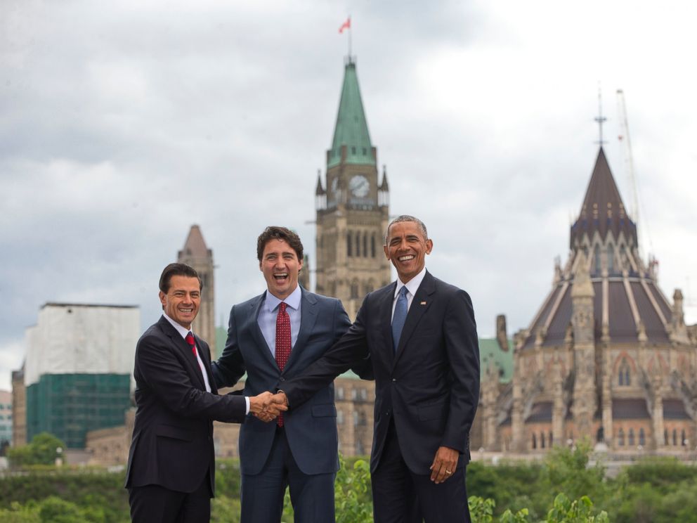 PHOTO: (L-R) Mexican President Enrique Pena Neito Mexican President Enrique Pena Neito and President Barack Obama stand in front of Parliament Hill for a group photo during the North America Leaders Summit, June 29, 2016, in Ottawa, Canada.