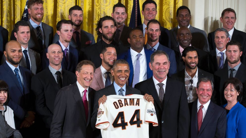 President Obama holds a Giants baseball
