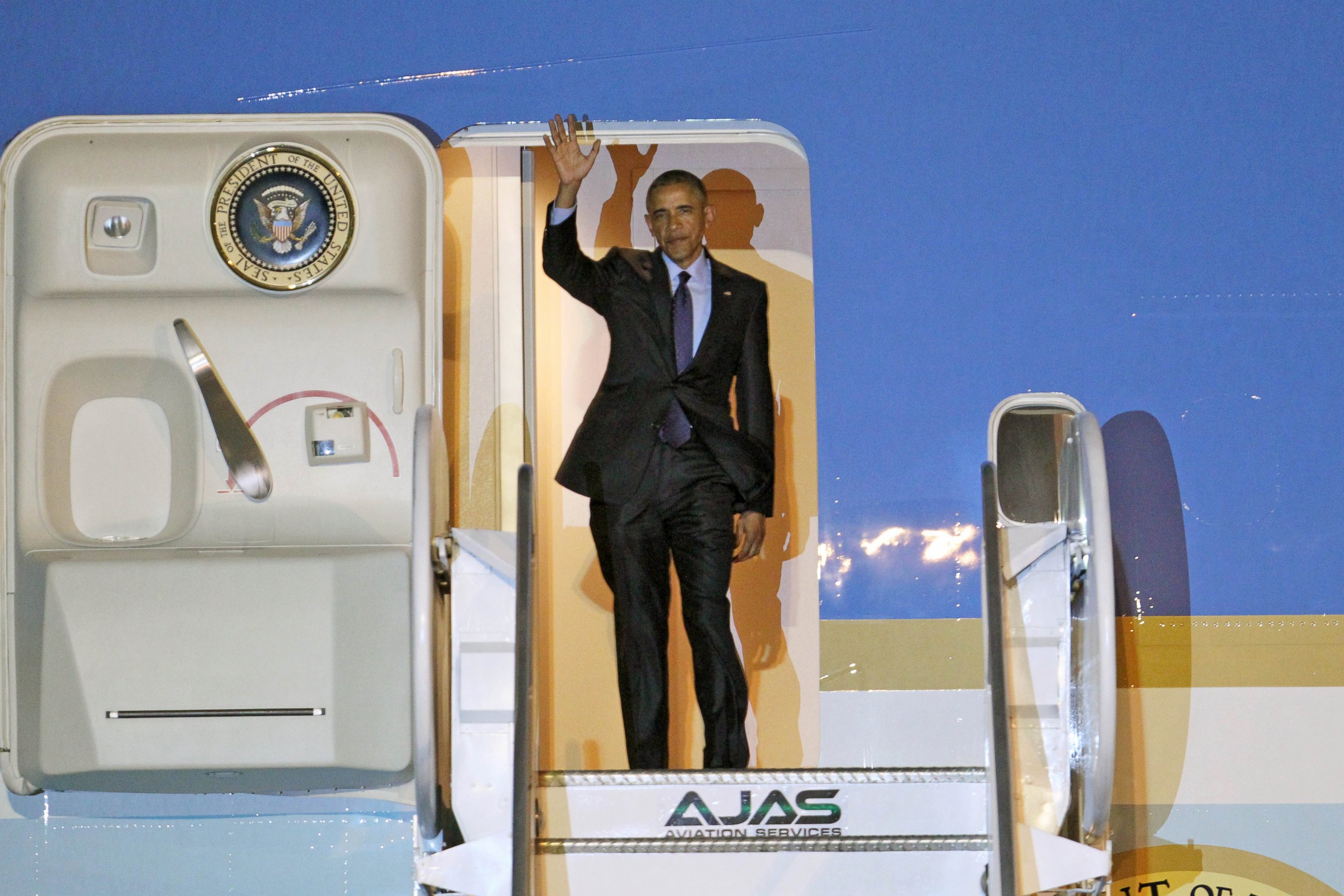 PHOTO: President Barack Obama waves during his arrival on Air Force One, April 8, 2015, at Norman Manley International Airport in Kingston, Jamaica.