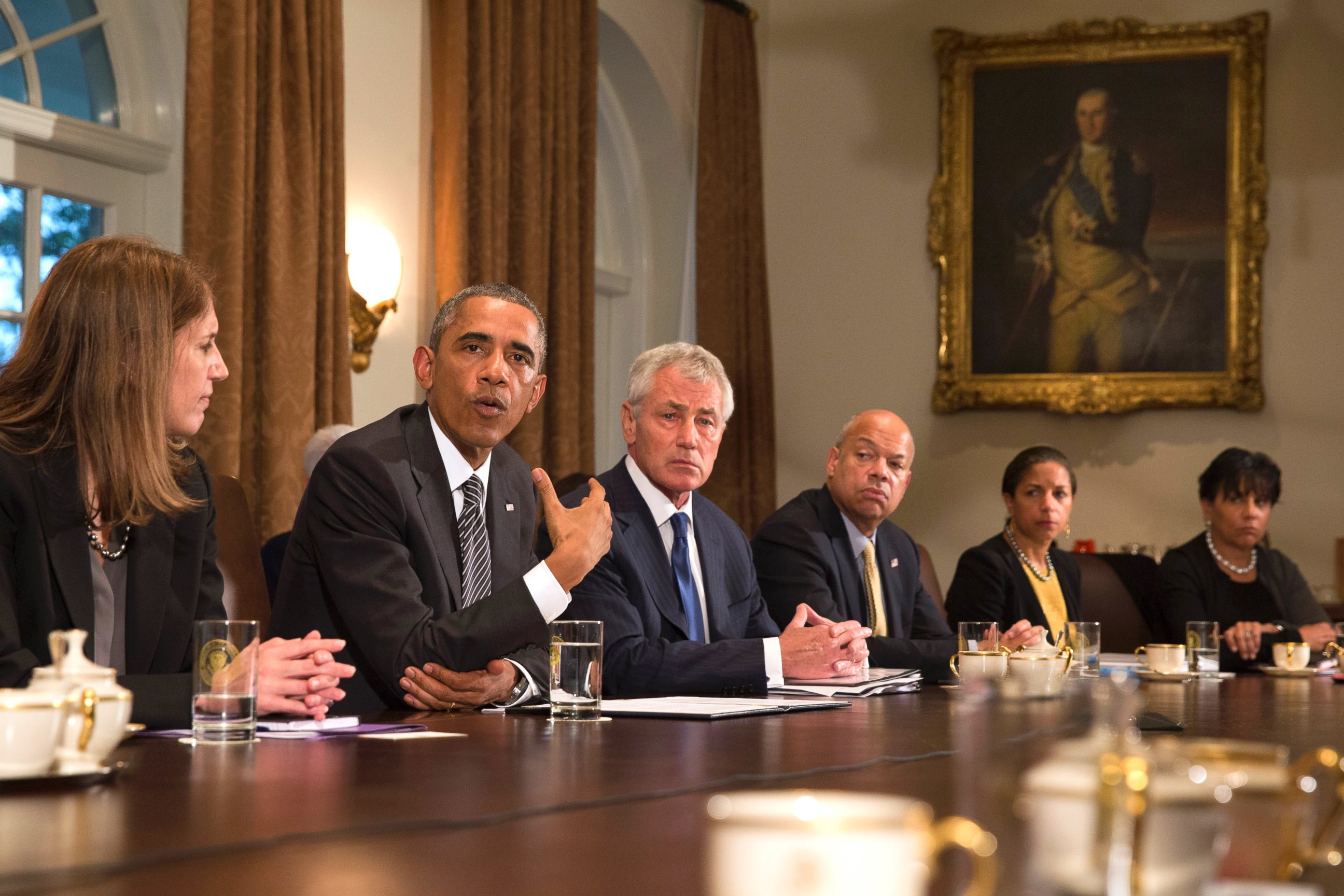 PHOTO: President Barack Obama, second from left, speaks to the media about Ebola during a meeting in the Cabinet Room of the White House in Washington, Oct. 15, 2014. 
