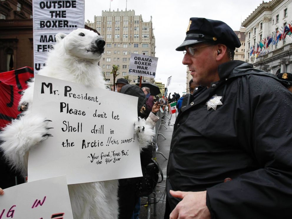 PHOTO: A demonstrator in a polar bear outfit talks to a police officer in San Francisco, May 25, 2010, in front of a hotel where President Obama plans to attend for a fund-raising campaign for Sen. Barbara Boxer, D-Calif.