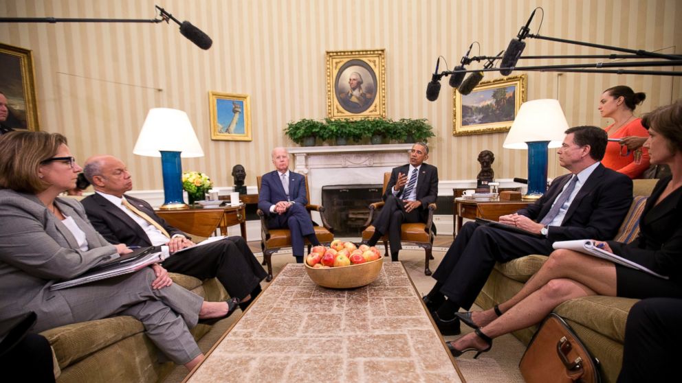 President Barack Obama, center, speaks to members of the media in the Oval Office of the White House in Washington, June 13, 2016.