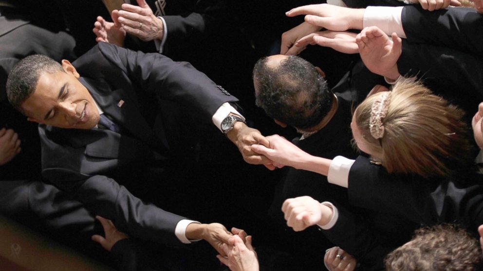 President Barack Obama shakes hands as he leaves the House chamber after the State of the Union address on Capitol Hill in Washington, Jan. 25, 2011.