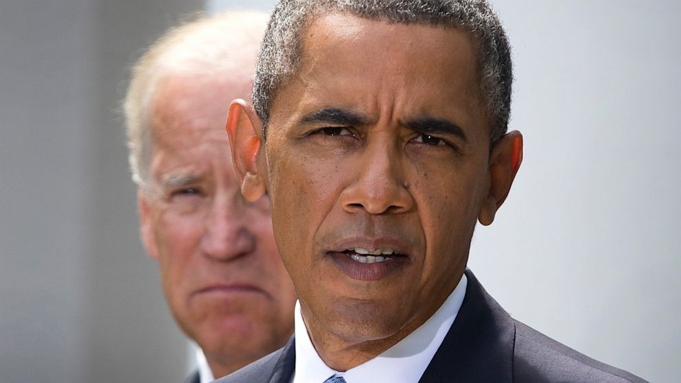 President Barack Obama, flanked by Vice President Joe Biden, talks about the crisis in Syria to media gathered in the Rose Garden of the White House Saturday, Aug. 31, 2013, in Washington.