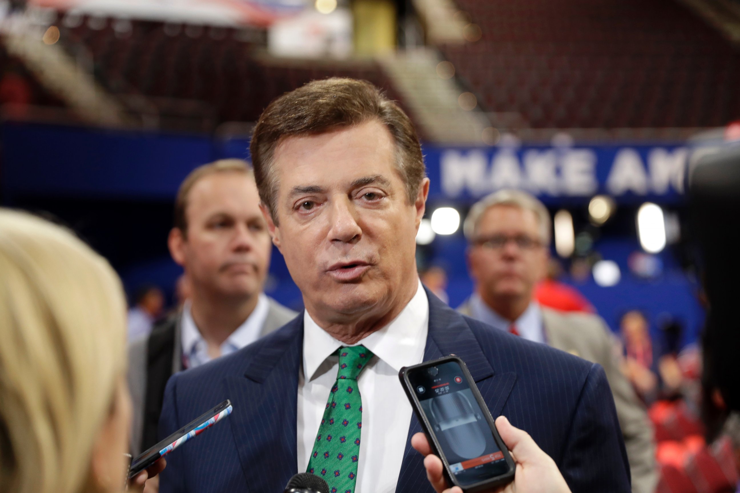 PHOTO: Trump Campaign Chairman Paul Manafort talks to reporters on the floor of the Republican National Convention at Quicken Loans Arena, July 17, 2016, in Cleveland. 