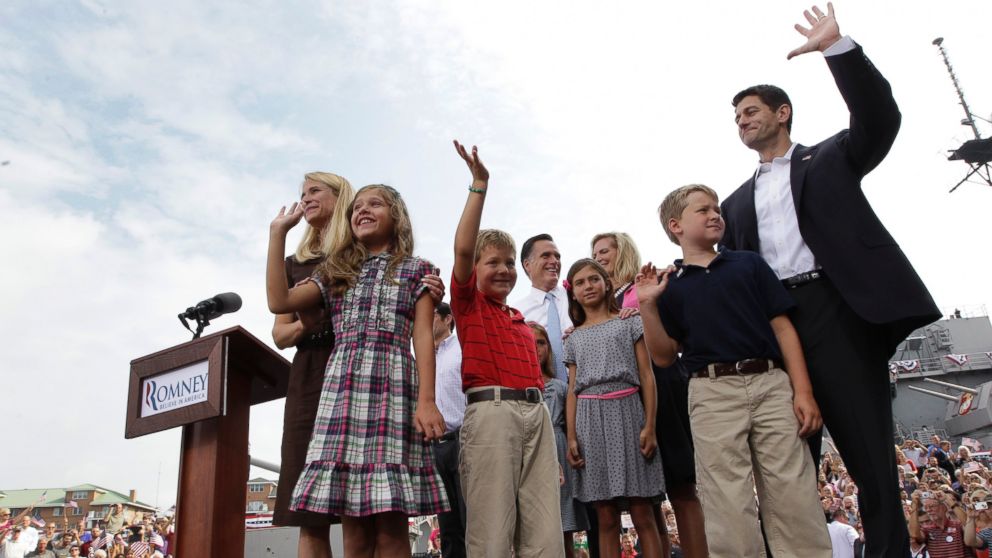 PHOTO: Newly announced Republican vice presidential candidate, Wisconsin Rep. Paul Ryan, and his family, and Republican presidential candidate, former Massachusetts Gov. Mitt Romney and his family, wave to the crowd, Aug. 11, 2012, in Norfolk, Virginia. 