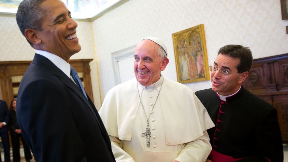 PHOTO: In this Thursday, March 27, 2014 file photo, U.S. President Barack Obama, left, reacts as he meets with Pope Francis, center, during their exchange of gifts at the Vatican.  