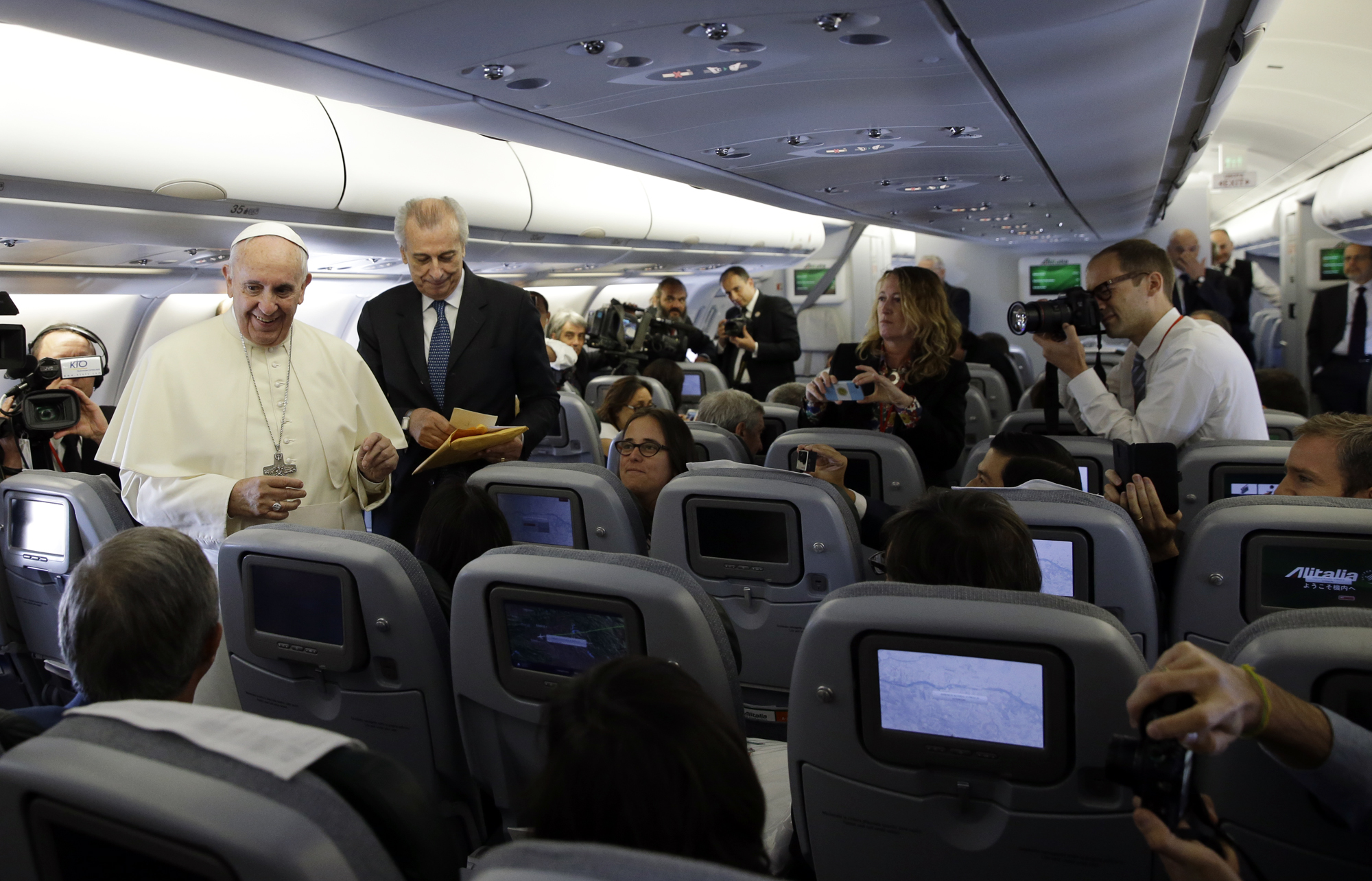 PHOTO: Pope Francis meets the journalists aboard the papal airplane on the occasion of his visit to Quito, Ecuador, July 5, 2015. 