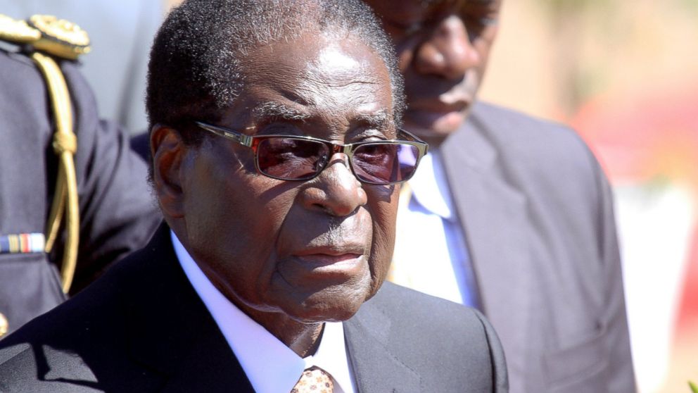 Zimbabwean President, Robert Mugabe, attends the burial of Major General Bandama who died after a short illness at the National Heroes acre in Harare, Zimbabwe, July, 17, 2014. 