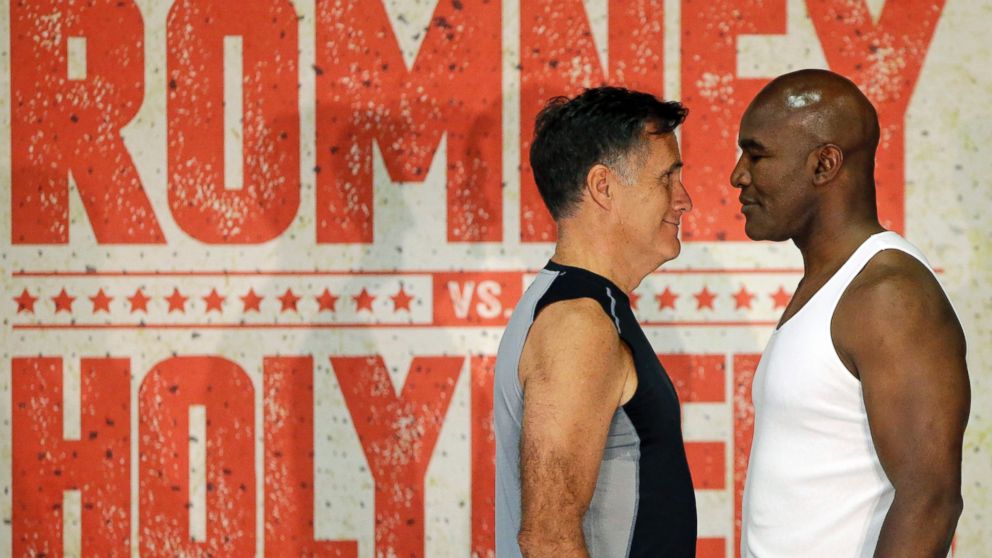 PHOTO: Mitt Romney, left, and Evander Holyfield, right, face each other during an official weigh-in on May 14, 2015, in Holladay, Utah.