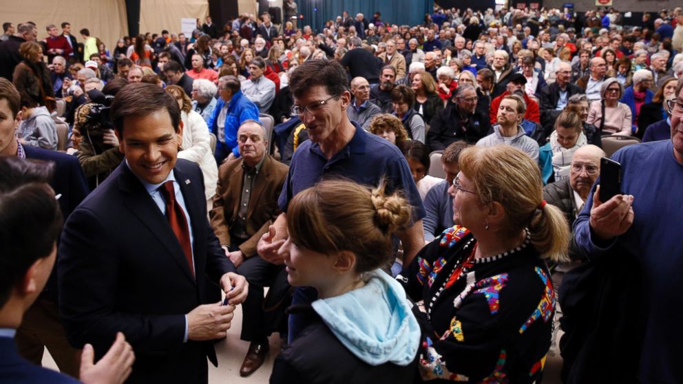 PHOTO: Republican presidential candidate Sen. Marco Rubio, talks with voters at a caucus site, Feb. 1, 2016 in Clive, Iowa.