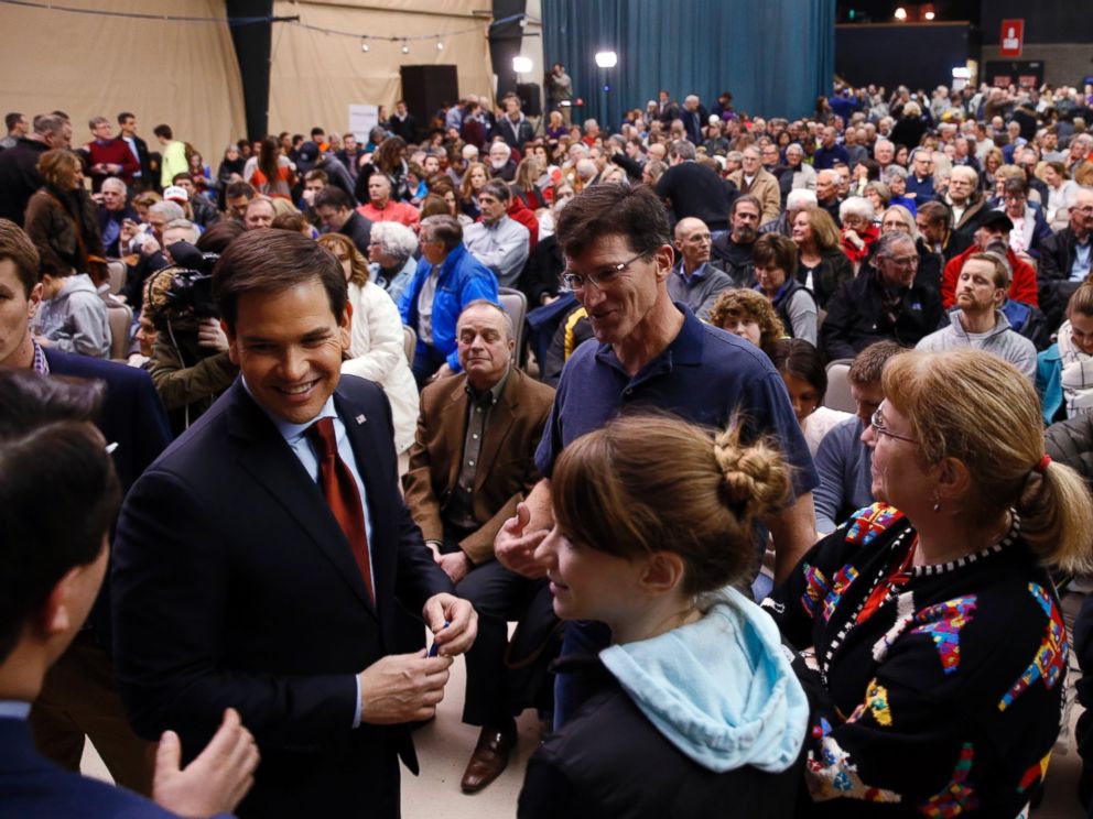 PHOTO: Republican presidential candidate Sen. Marco Rubio, talks with voters at a caucus site, Feb. 1, 2016 in Clive, Iowa.