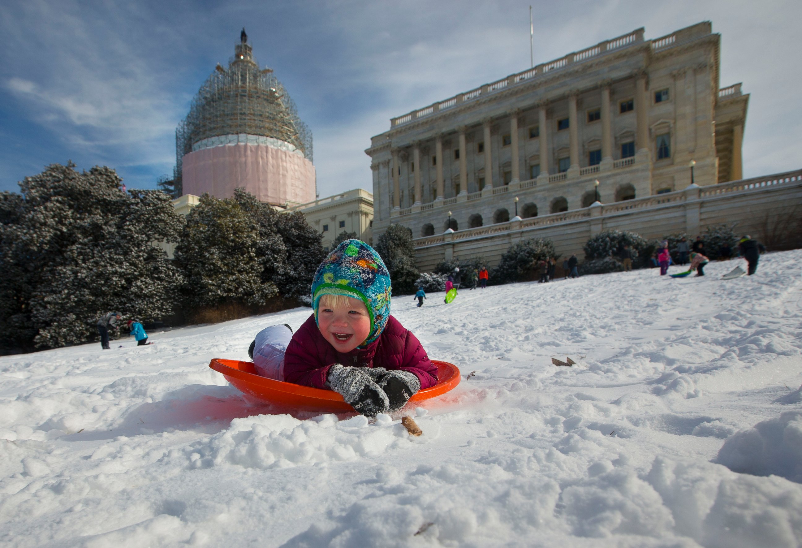 PHOTO: James Drobnyk, 2, joins others in sledding down the hill on Capitol Hill in Washington, D.C. on Feb. 17, 2015. 