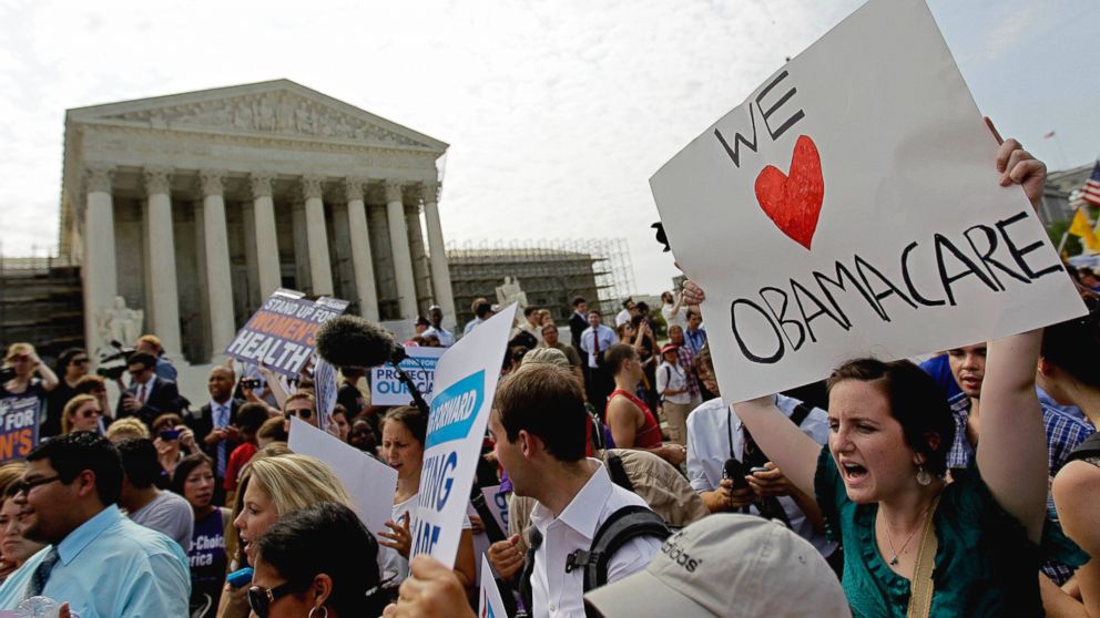 Supporters of President Barack Obama's health care law celebrate outside the Supreme Court in Washington, Thursday, June 28, 2012, after the court's ruling was announced. 