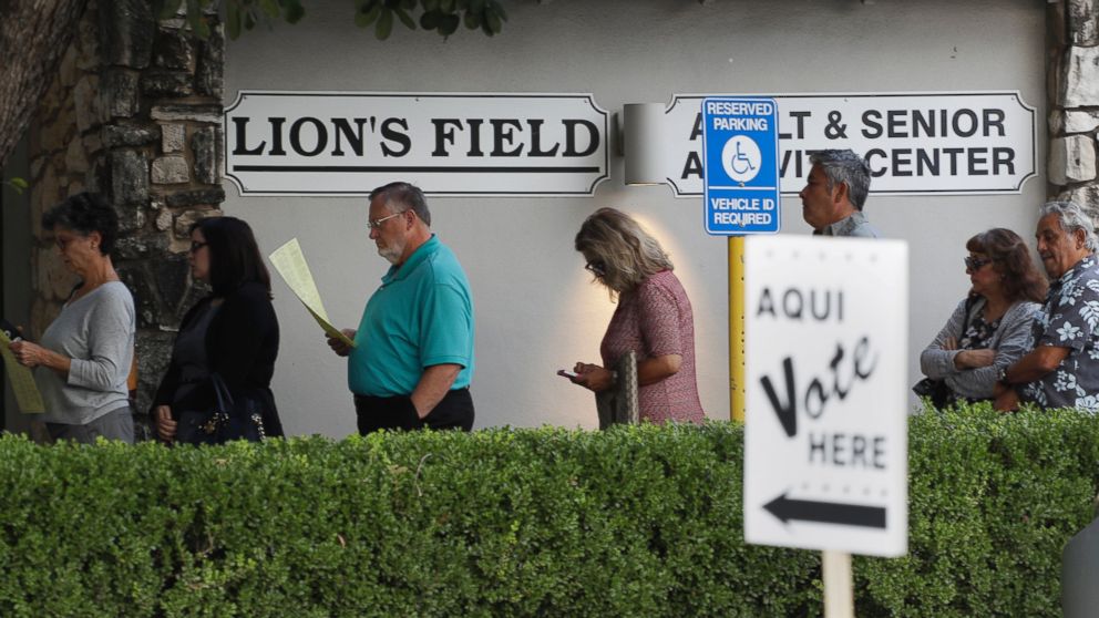 PHOTO: Voters stand in line at an early polling site, Oct. 24, 2016, in San Antonio, Texas. 