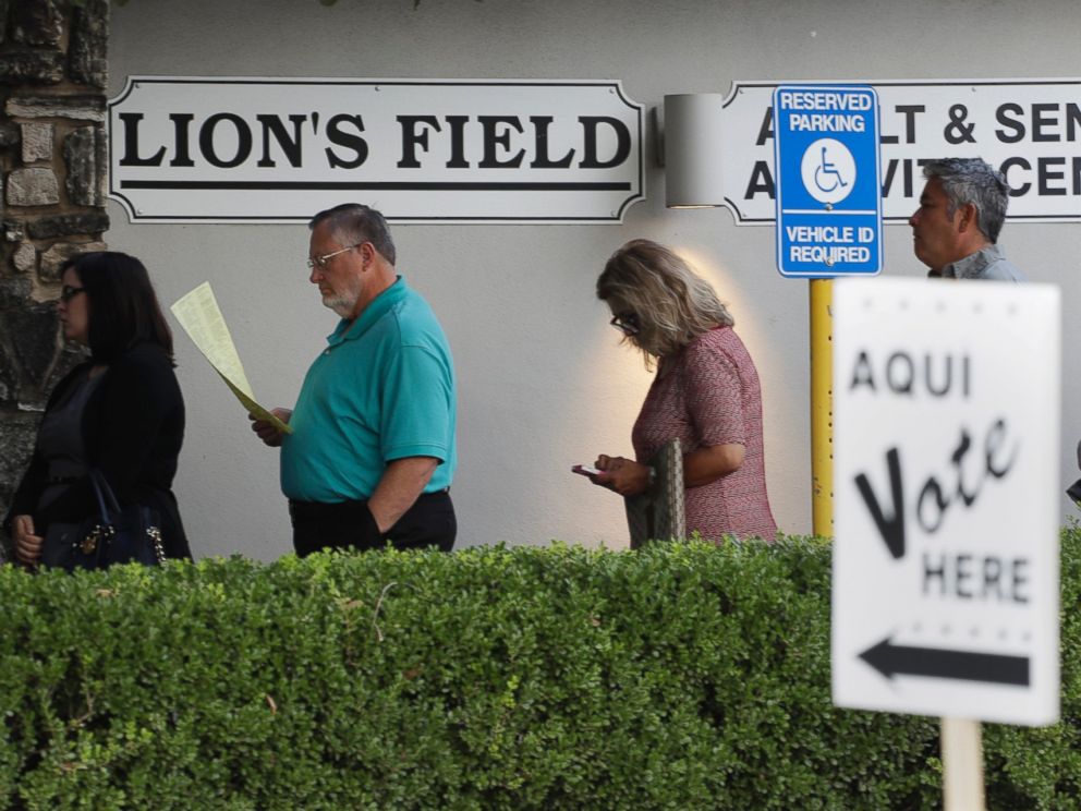 PHOTO: Voters stand in line at an early polling site, Oct. 24, 2016, in San Antonio, Texas.