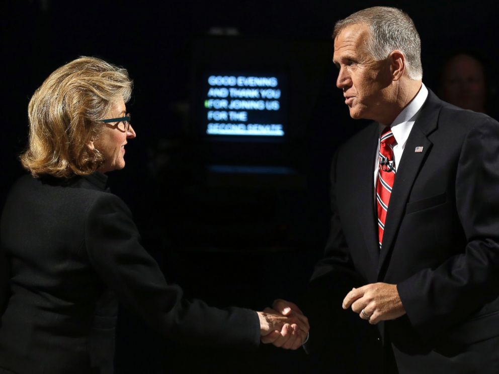 PHOTO: Sen. Kay Hagan, left, D-N.C., and North Carolina Republican Senate candidate Thom Tillis, right, greet prior to a live televised debate in Research Triangle Park, N.C. on Oct. 7, 2014.