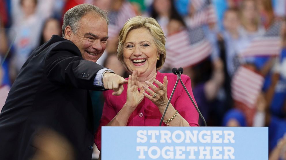 Democratic presidential candidate Hillary Clinton and her running mate, Democratic vice presidential candidate, Sen. Tim Kaine, react after a campaign rally at Temple University, July 29, 2016, in Philadelphia. 