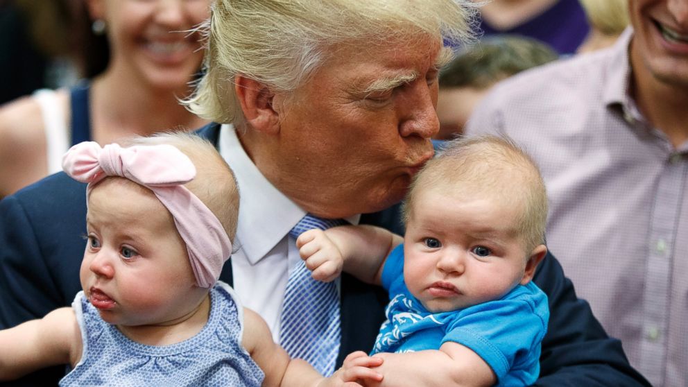 Donald Trump kisses a baby during a campaign rally, July 29, 2016, in Colorado Springs, Colorado.