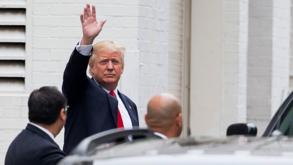 Republican presidential candidate Donald Trump waves as he arrives for a meeting with House Speaker Paul Ryan of Wis., at the Republican National Committee Headquarters on Capitol Hill in Washington, May 12, 2016.  