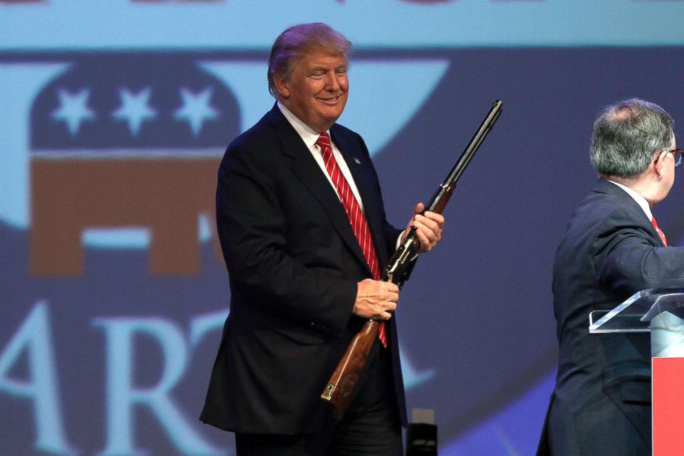 PHOTO: Donald Trump holds a Henry repeating rifle that was presented to him after speaking at the Republican Party of Arkansas Reagan Rockefeller dinner in Hot Springs, Ark., July 17, 2015.
