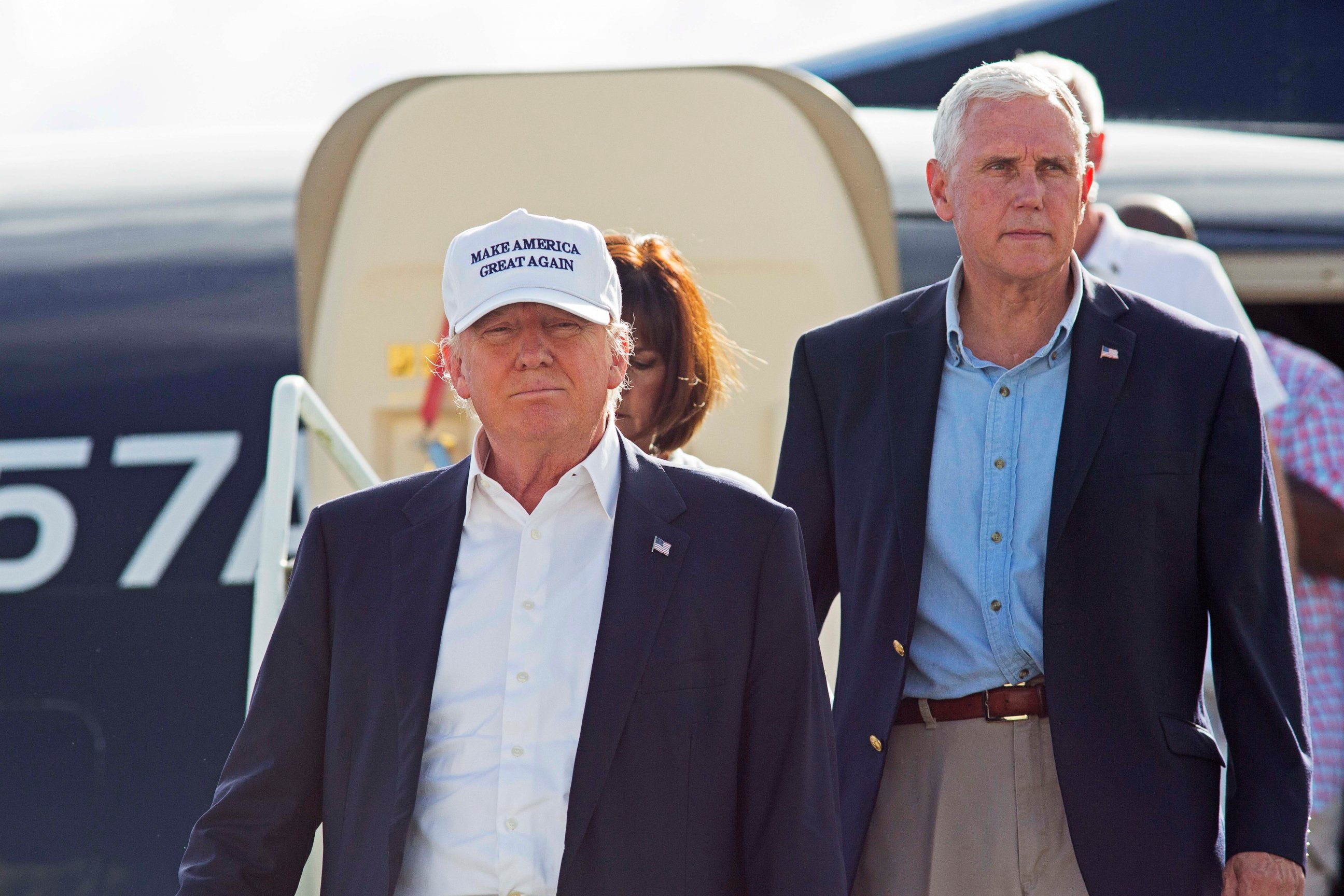 PHOTO: Republican presidential candidate Donald Trump, followed by his running mate, Indiana Gov. Mike Pence, emerges from his plane as he arrives to tour the flood damaged city of Baton Rouge, La., Aug. 19, 2016.