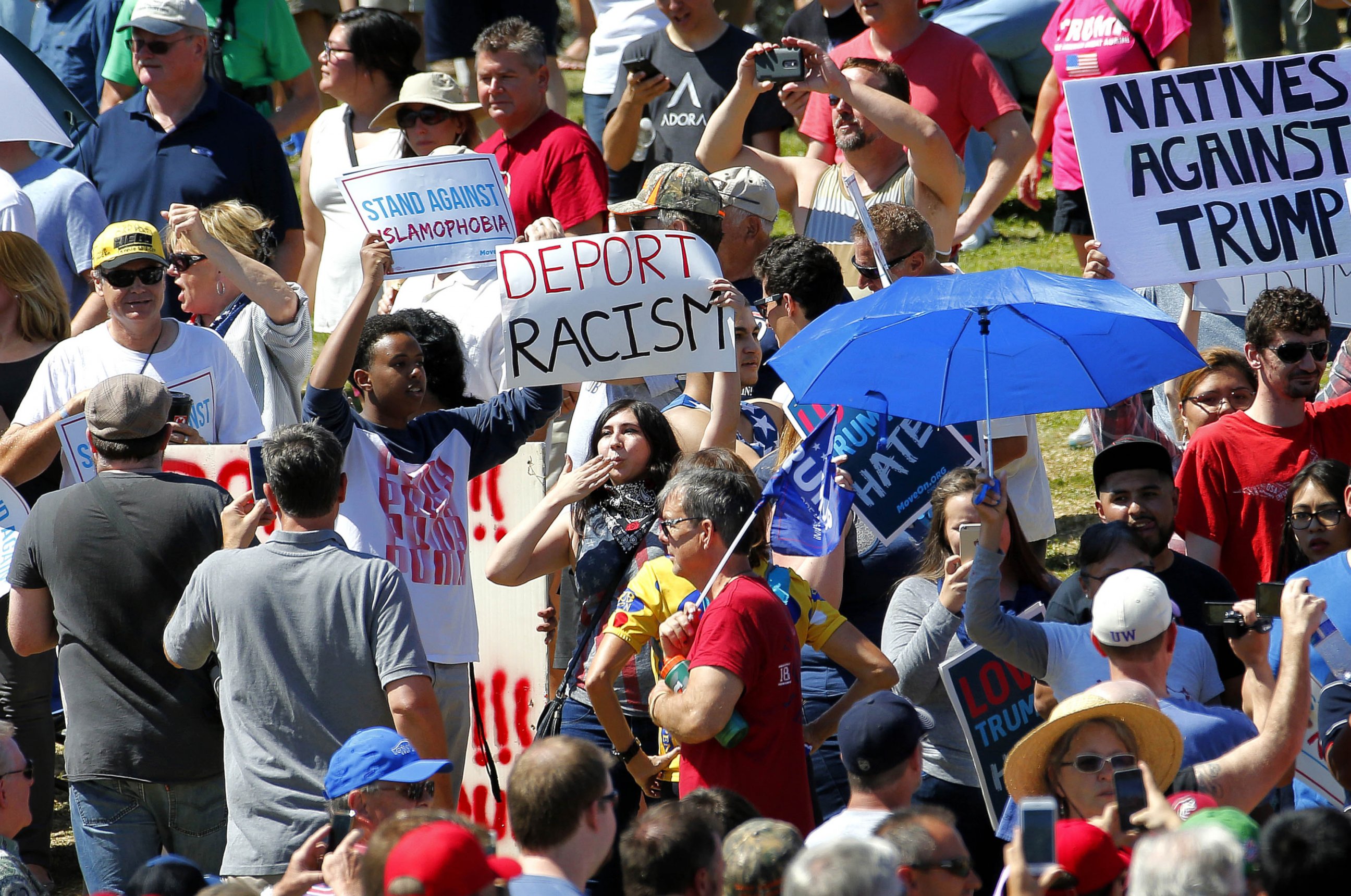 PHOTO:Protesters stand in the crowd of Republican presidential candidate Donald Trump supporters as Trump speaks during a campaign rally, March 19, 2016, in Fountain Hills, Ariz.  
