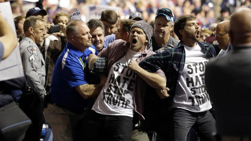 Protesters are removed as Republican presidential candidate Donald Trump speaks during a campaign rally in Fayetteville, N.C., March 9, 2016. 