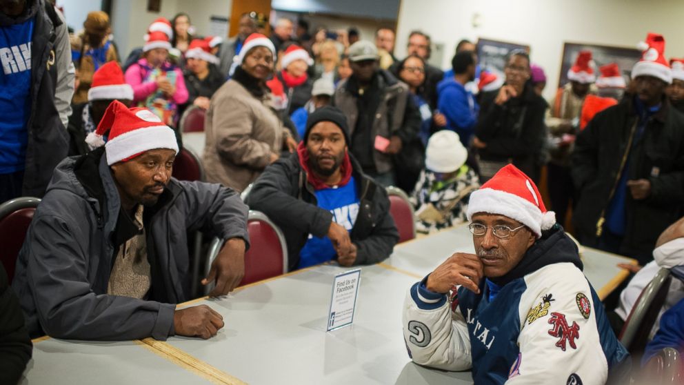 Warner Massey, right, a contract employee with the Goodwill of Greater Washington who works in the Senate, and other low-wage employees stage a strike in the Dirksen cafeteria after a new contract for the workers failed to meet the $15 per hour demand, in Washington, D.C., Dec. 8, 2015.