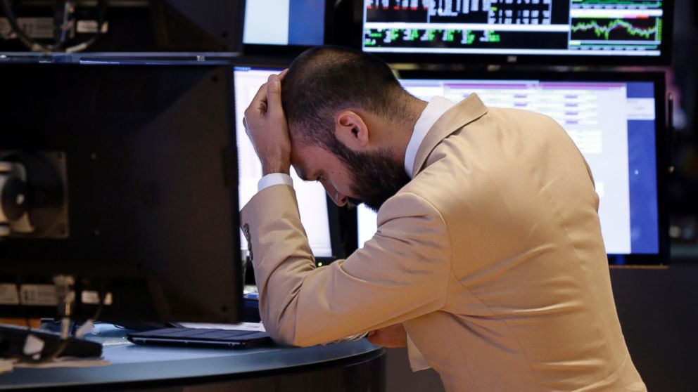 Specialist Fabian Caceres works on the floor of the New York Stock Exchange in New York, Oct. 7, 2013.