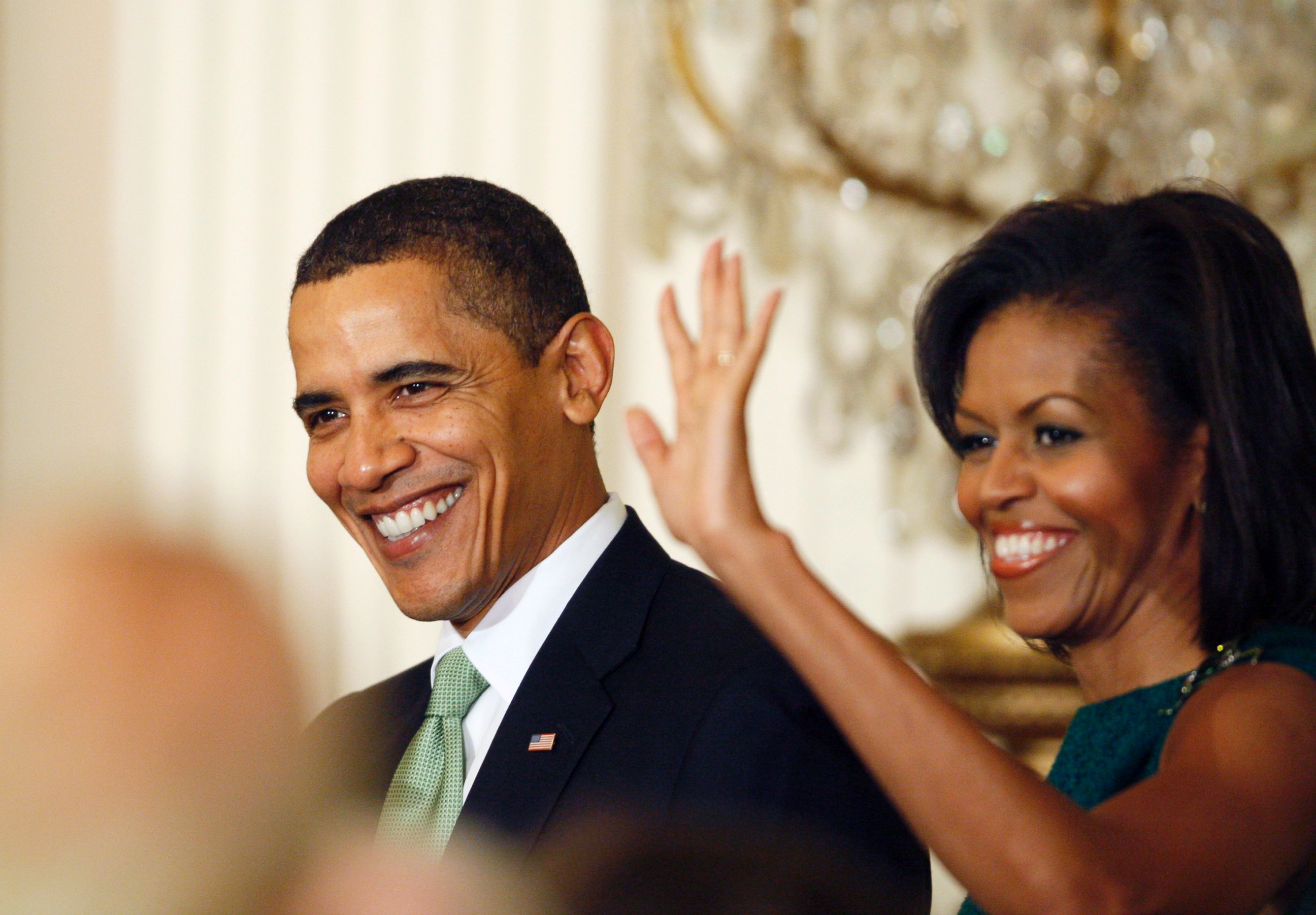 PHOTO: President Barack Obama and Michelle Obama arrive in the East Room of the White House in Washington as they host a St. Patrick's Day reception, March 17, 2009.
