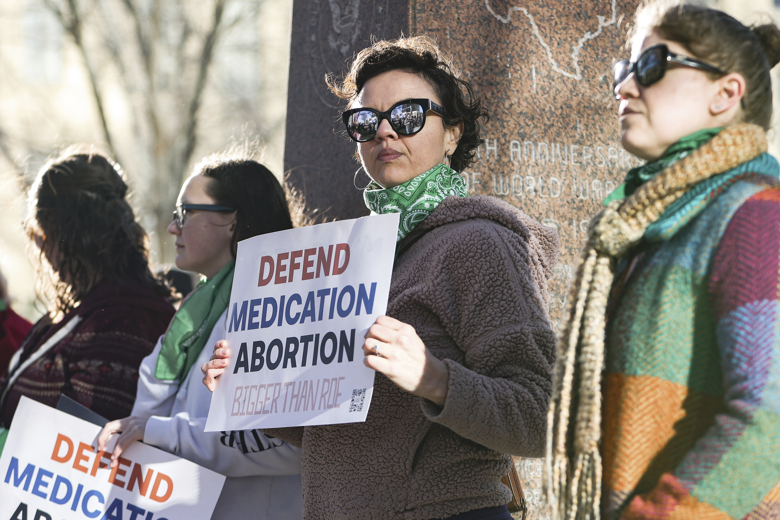PHOTO: Lindsay London holds protest sign in front of federal court building in support of access to abortion medication outside the Federal Courthouse, March 15, 2023, in Amarillo, Texas.