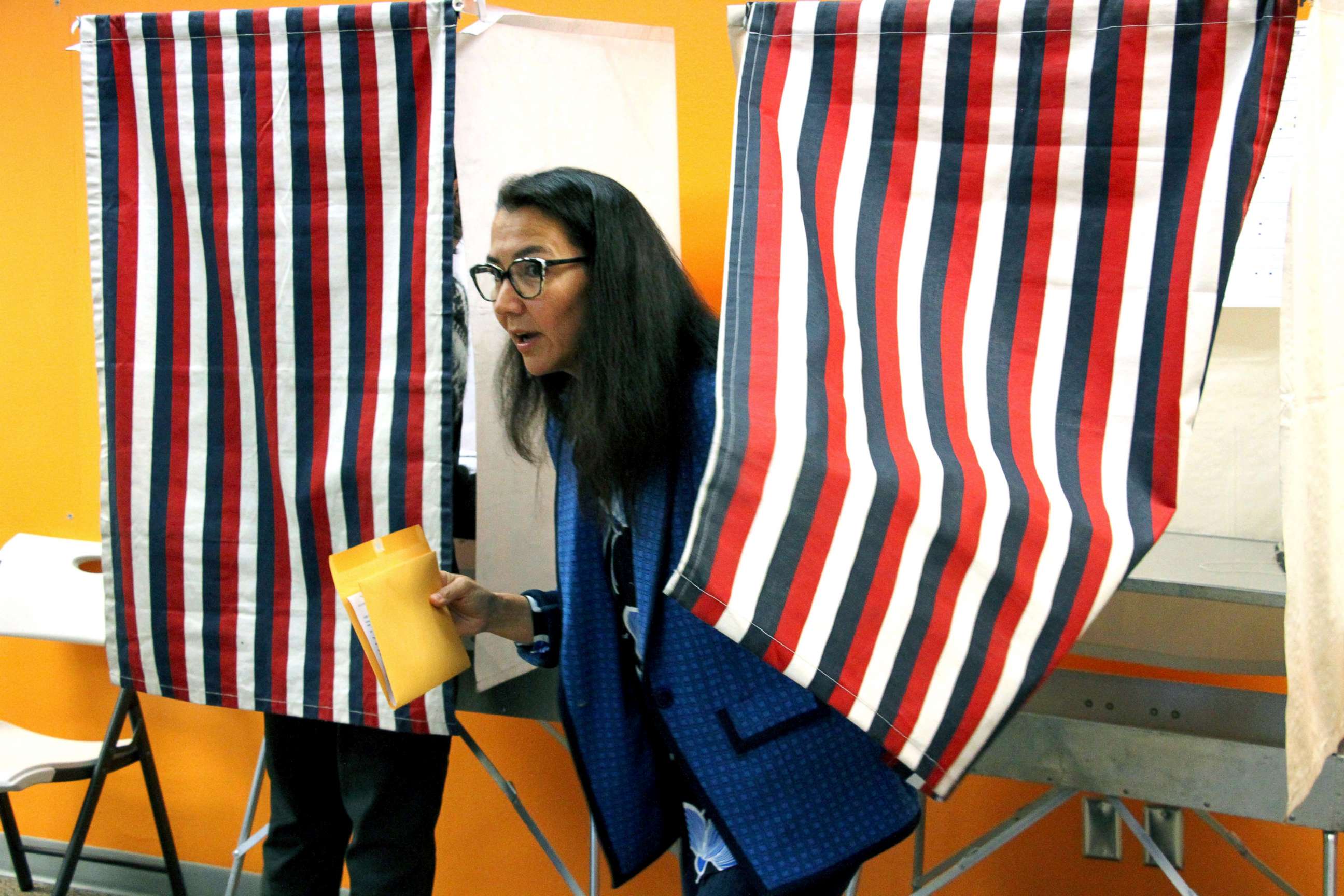 PHOTO: Mary Peltola is shown leaving a voting booth while early voting on Friday, Aug. 12, 2022, in Anchorage, Alaska. 