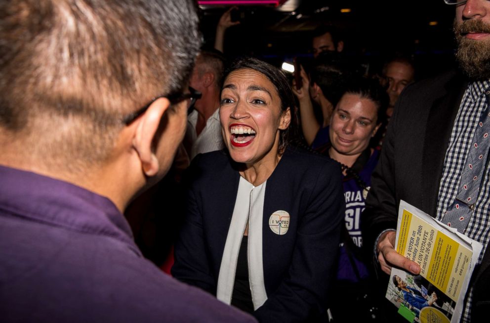 PHOTO: Progressive challenger Alexandria Ocasio-Cortez celebrates with supporters at a victory party in the Bronx after upsetting incumbent Democratic Representative Joseph Crowly on June 26, 2018 in New York.