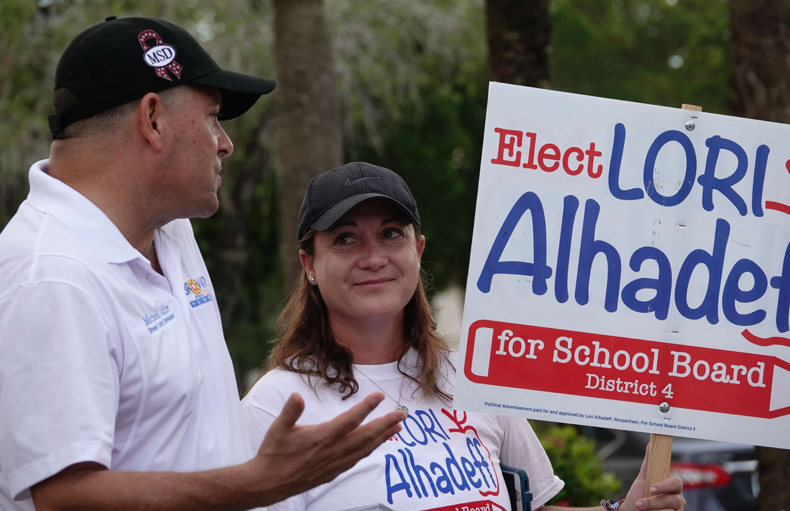 PHOTO: Lori Alhadeff speaks with County Commissioner Michael Udine at a polling place in Tamarac, Fla., Aug. 28, 2018.