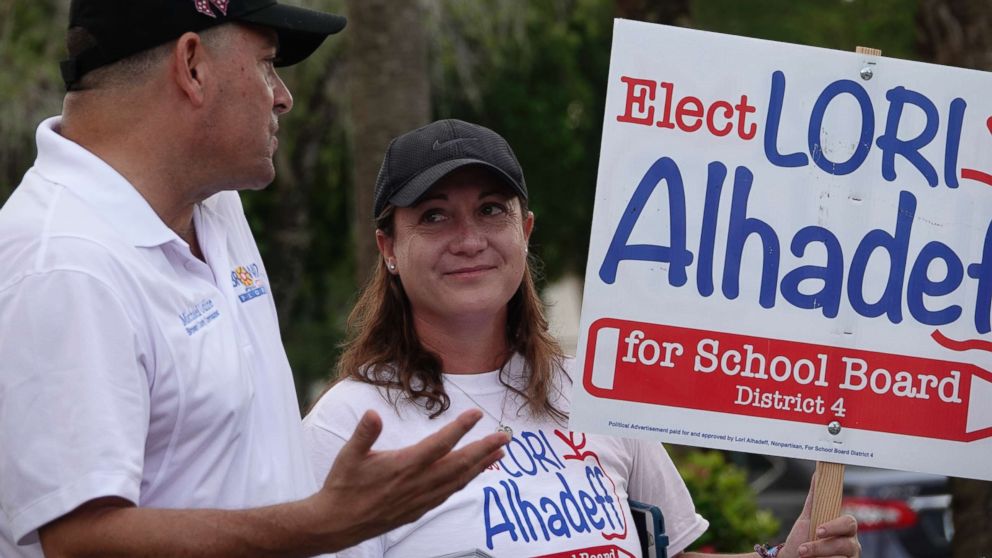 PHOTO: Lori Alhadeff speaks with County Commissioner Michael Udine at a polling place in Tamarac, Fla., Aug. 28, 2018.