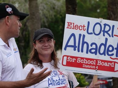PHOTO: Lori Alhadeff speaks with County Commissioner Michael Udine at a polling place in Tamarac, Fla., Aug. 28, 2018.