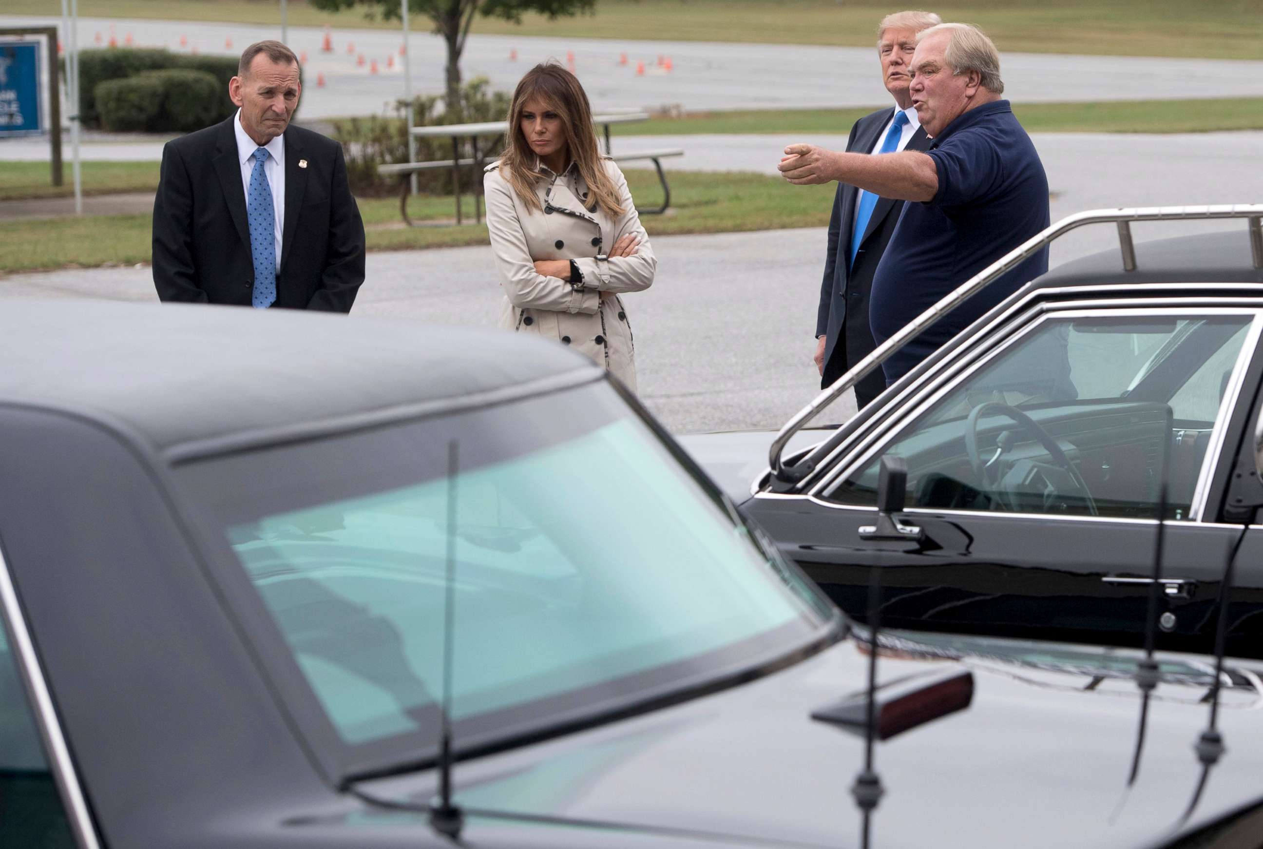 From left,  Secret Service Director Randolph Alles, first lady Melania Trump, President Donald Trump and an unnamed person, look at vehicles at the United States Secret Service James J. Rowley training facility in Beltsville, Md., Oct. 13, 2017.