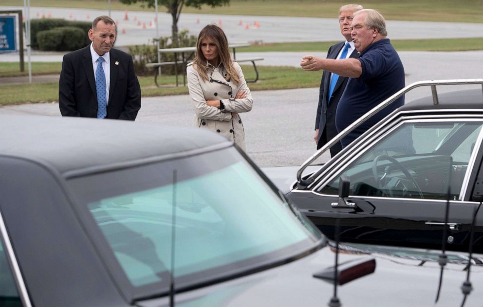 From left,  Secret Service Director Randolph Alles, first lady Melania Trump, President Donald Trump and an unnamed person, look at vehicles at the United States Secret Service James J. Rowley training facility in Beltsville, Md., Oct. 13, 2017.