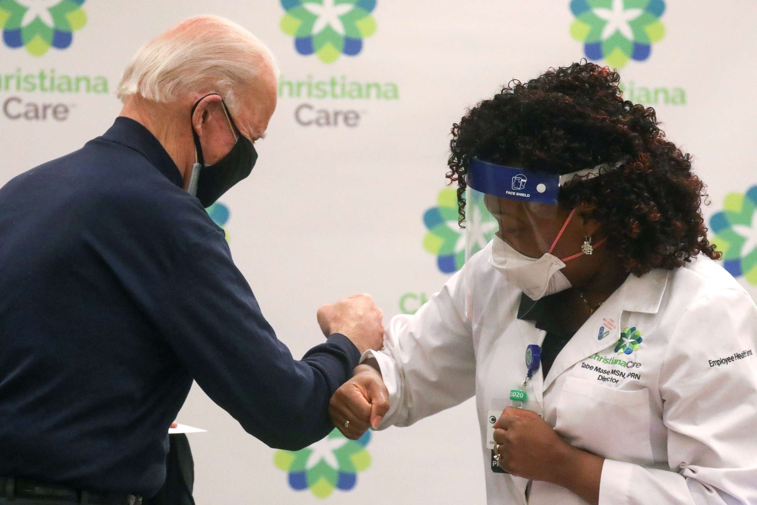 PHOTO: President-elect Joe Biden elbow bumps nurse practitioner Tabe Mase after receiving a dose of a vaccine against the coronavirus disease (COVID-19) at ChristianaCare Christiana Hospital, in Newark, Del., Dec. 21, 2020.