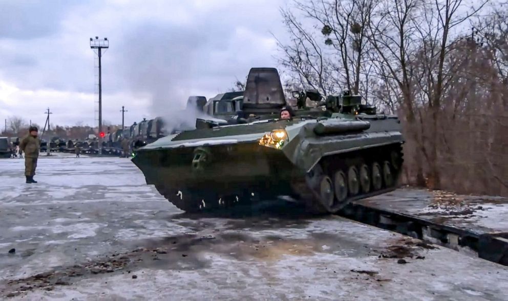 PHOTO: In this photo taken from video provided by the Russian Defense Ministry Press Service, A Russian armored vehicle drives off a railway platform after arrival in Belarus, Jan. 19, 2022. 